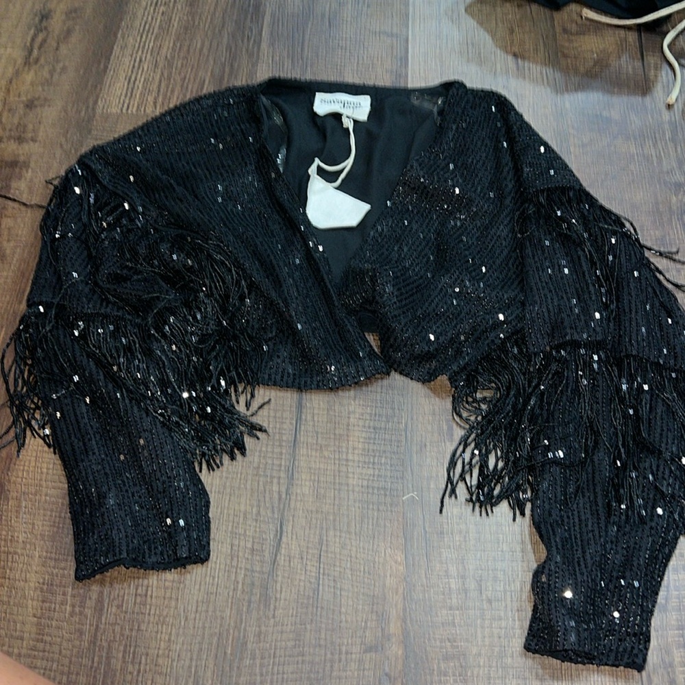 Black cropped sequin shacket. With fringe details